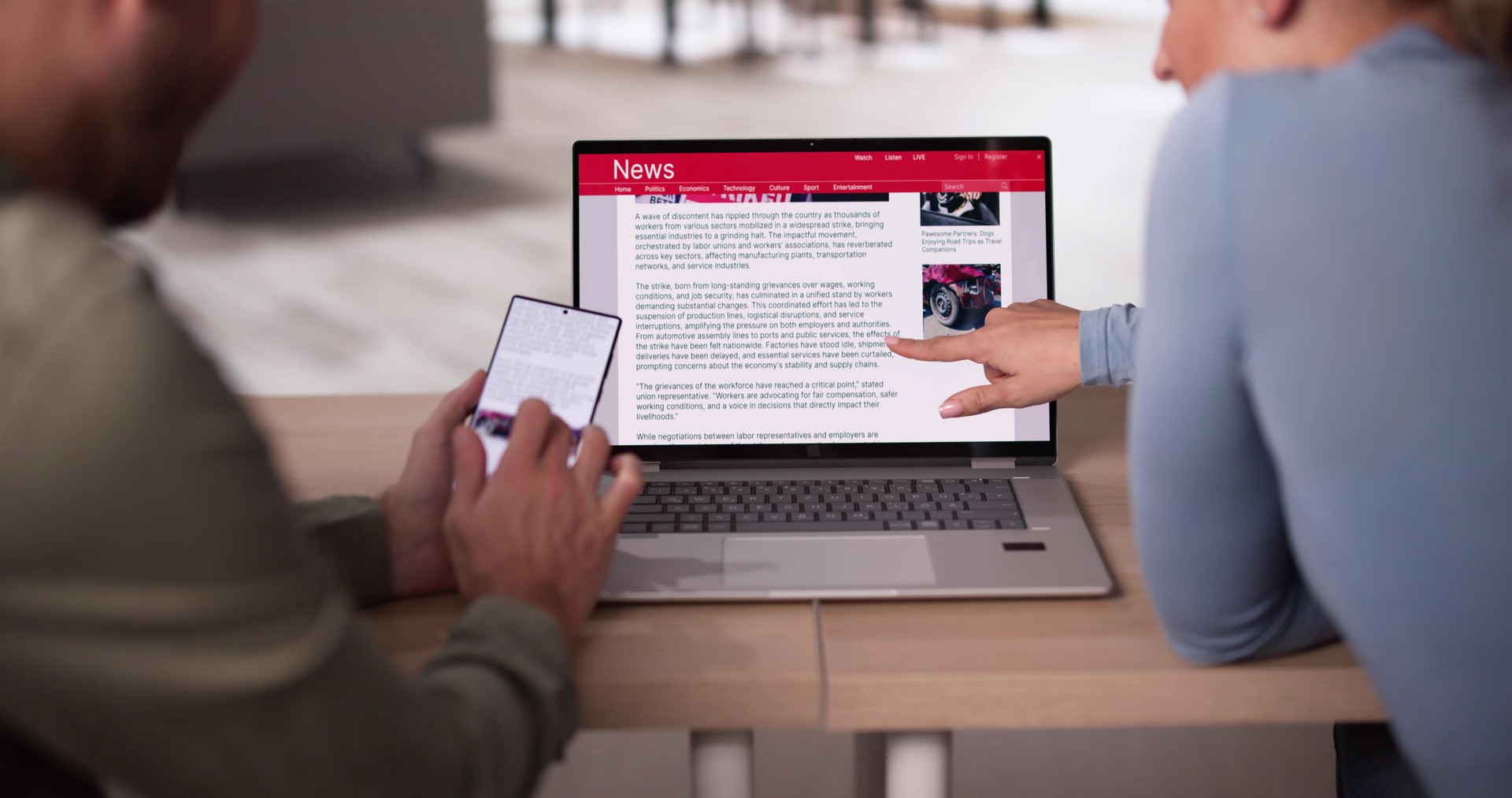 Watching News On Screen. Reading Newspaper Website